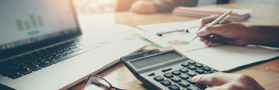 An individual using a calculator.